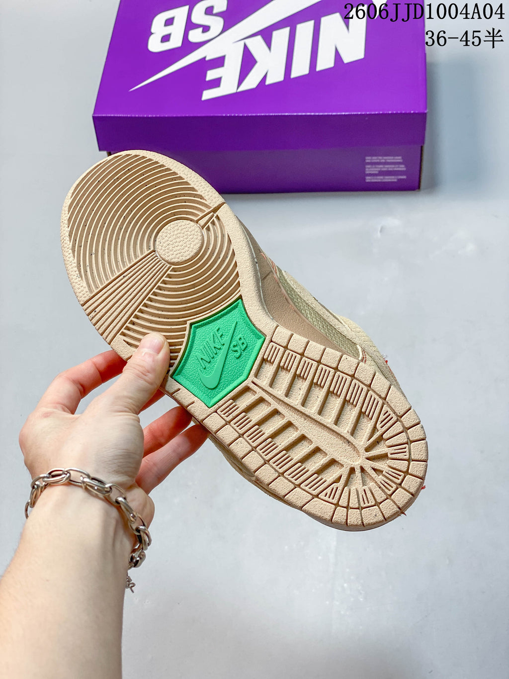 Close-up of the tan rubber outsole with a circular traction pattern