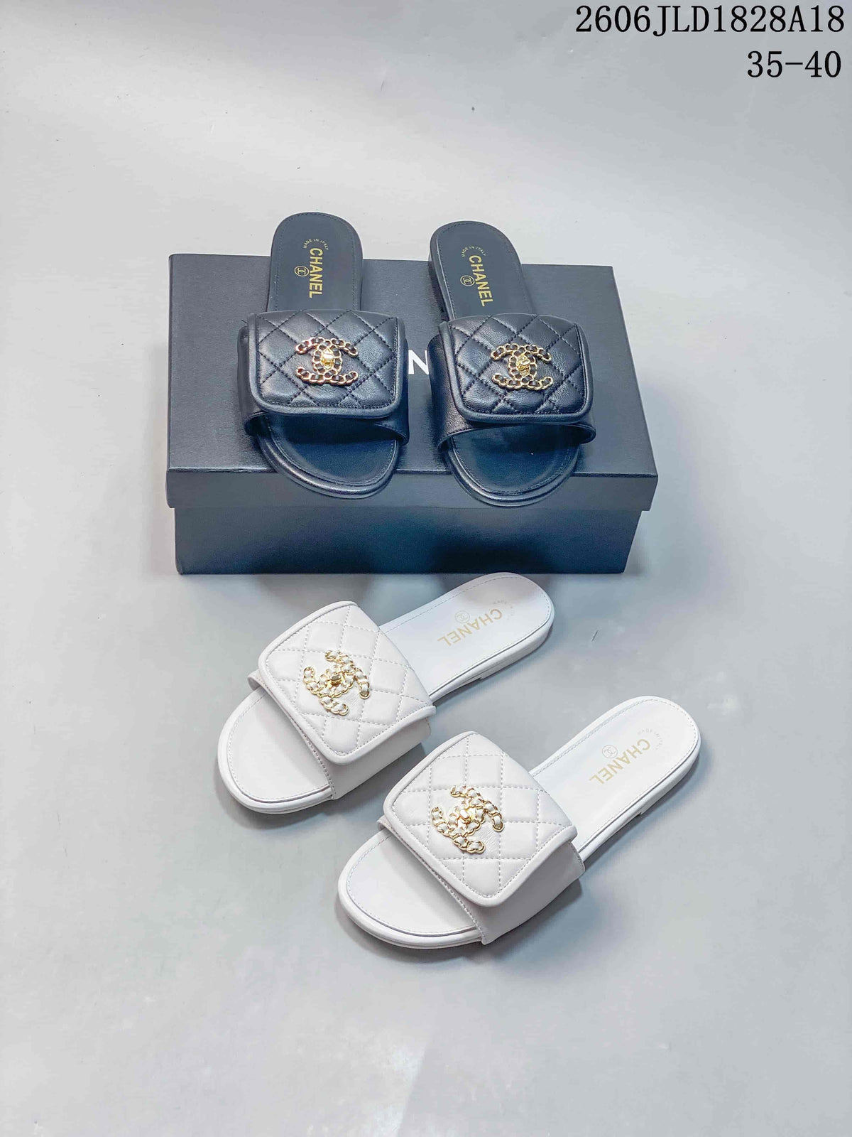 Black and white quilted slide sandals displayed together.