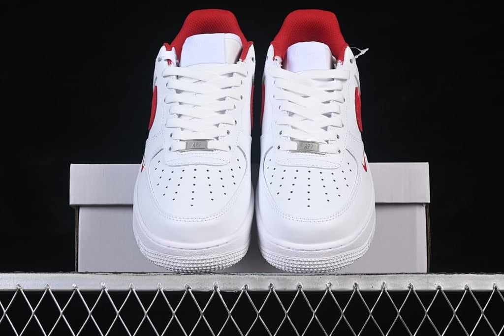 Front view of the pair showing perforated toes, white laces, and red collar lining.