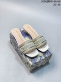 Pair of gold-toned embroidered Dway mule sandals with square toes and cylindrical heels