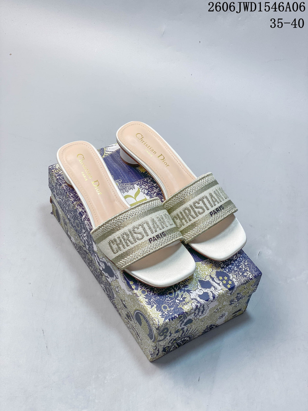 Pair of gold-toned embroidered Dway mule sandals with square toes and cylindrical heels