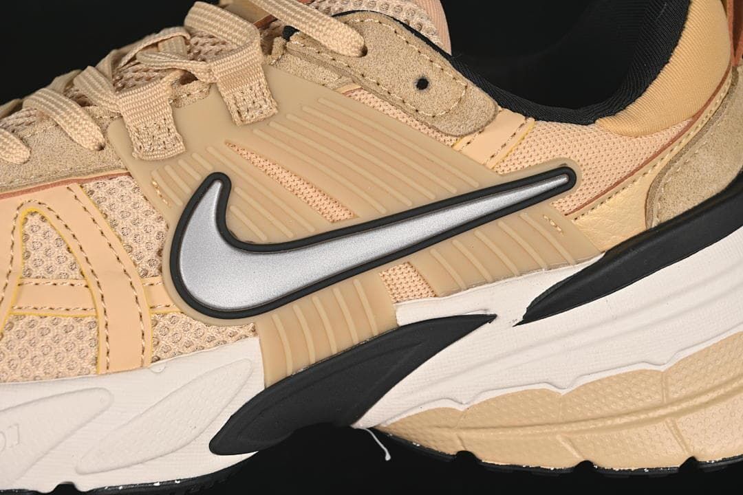 Close-up of the silver Swoosh and layered side panels