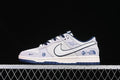 Side view of light gray and white Nike SB Dunk Low sneakers with navy accents and Snake Year graphics.