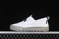 Side view of a white The North Face slip-on shoe with a grey outsole
