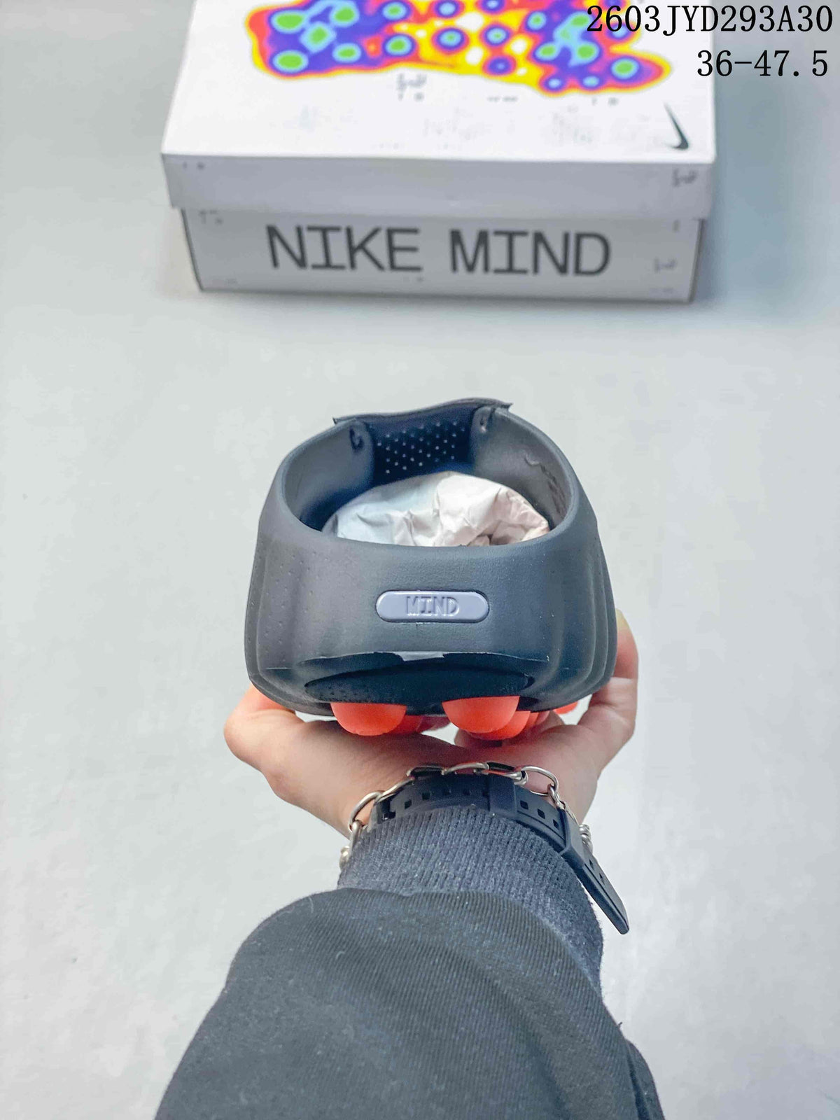 Rear view of a Nike Mind slide with a sculpted heel