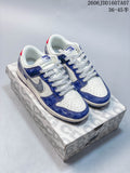 Pair of blue, white, and gray low-top sneakers on a patterned box