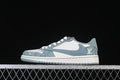 Side view of a white and blue Jordan 1 Low with denim-style patterned panels and a blue Swoosh