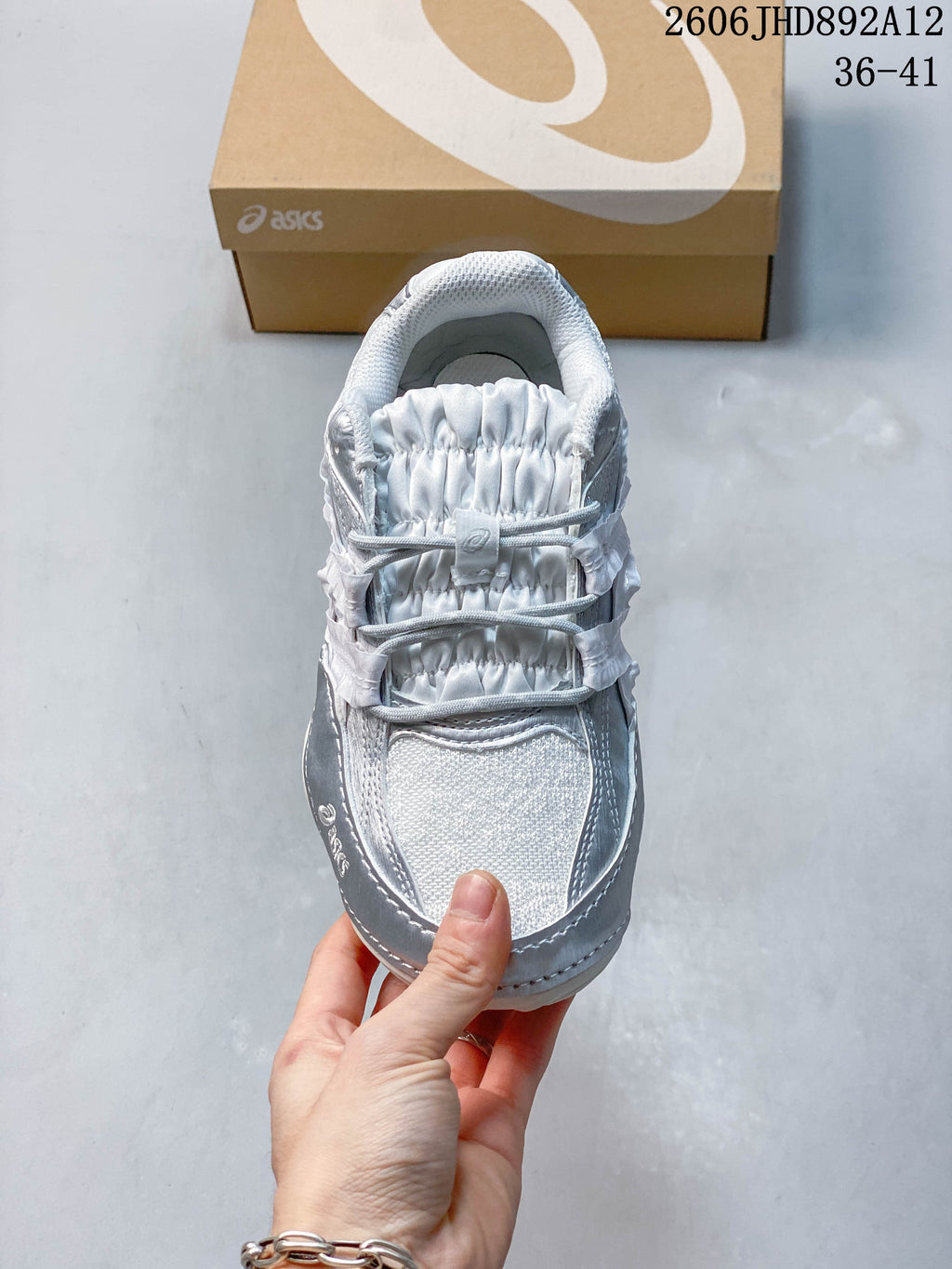 Top view highlighting the gathered tongue and cord-style laces