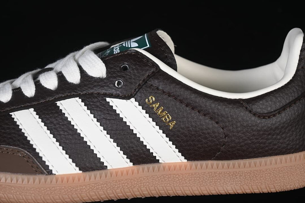 Detail of the brown upper, white stripes, and gold Samba lettering