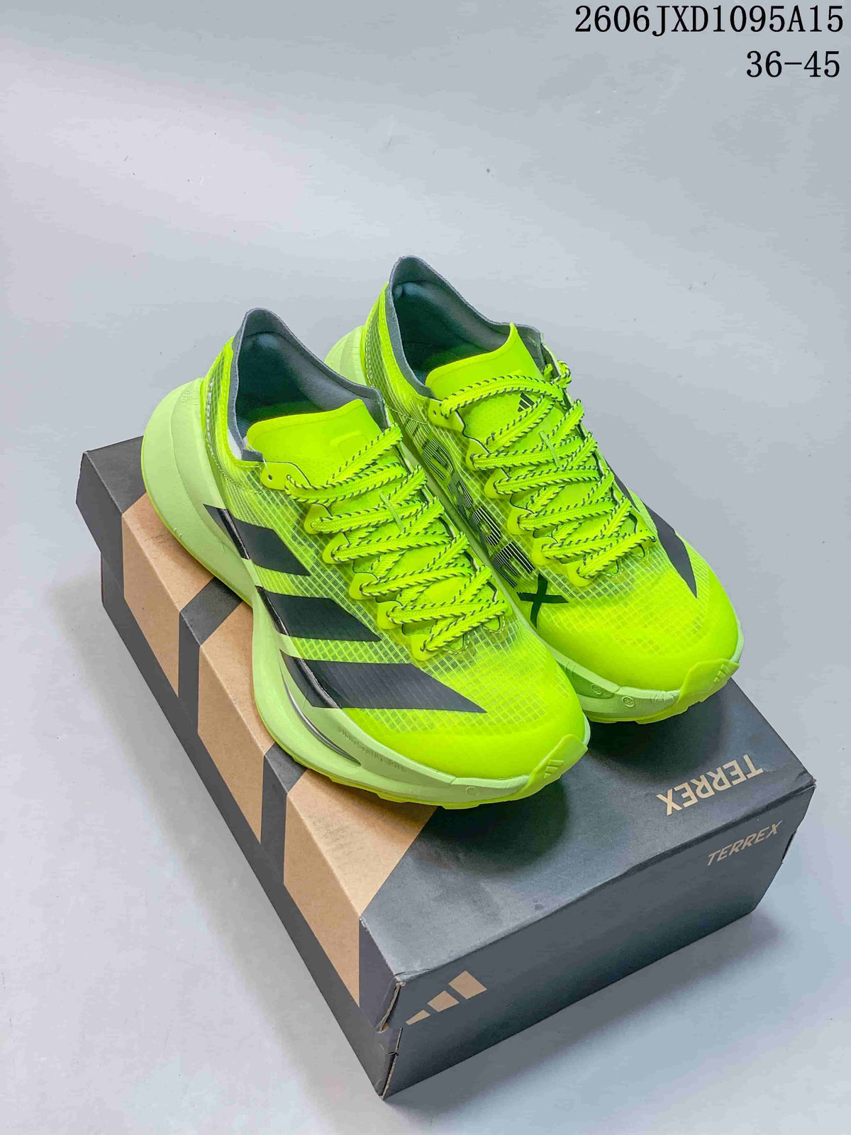 Neon yellow Adidas Terrex trail running shoes on a branded box