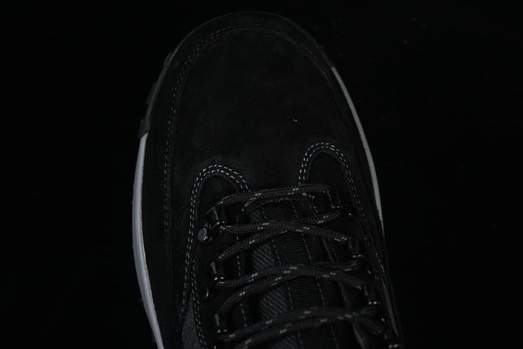 Top-down view of the boot toe and lace-up front.