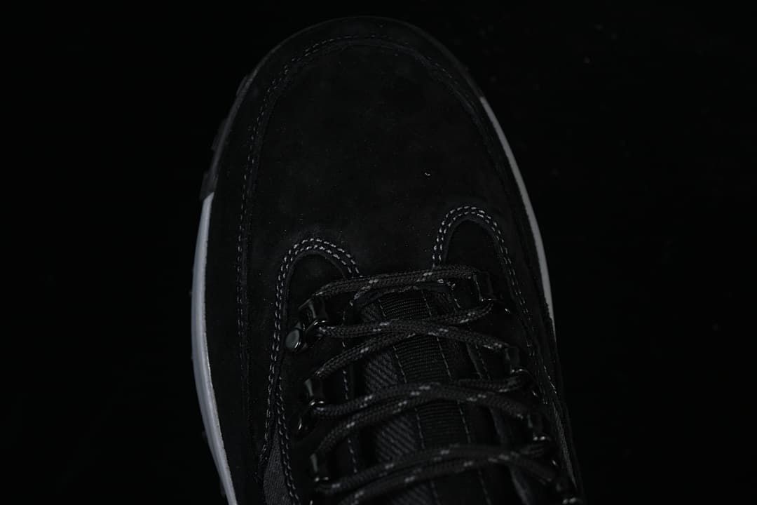Top-down view of the boot toe and lace-up front.