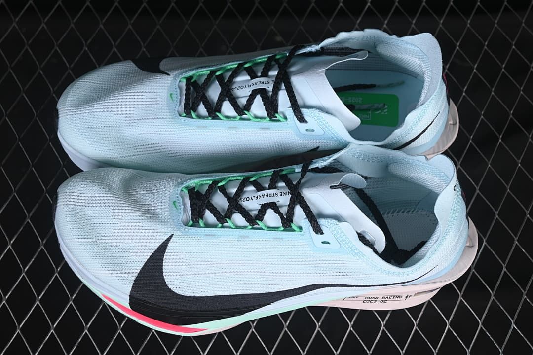 Pair of pale blue running shoes shown from above