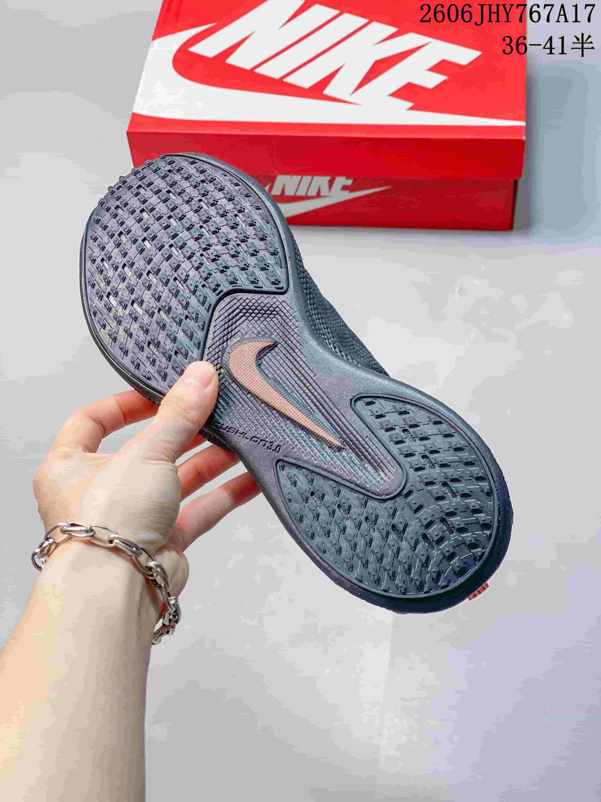 Close view of the patterned outsole on a dark gray Nike Ava Rover sneaker.