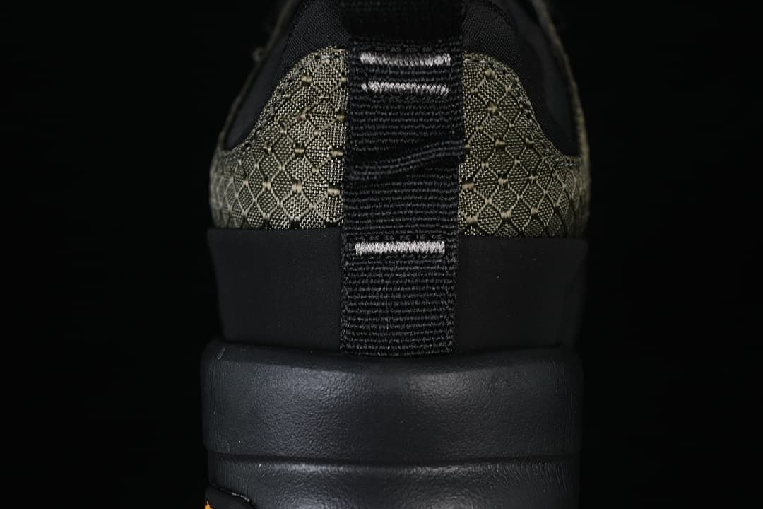 Rear view showing the patterned heel, pull tab, and black sole