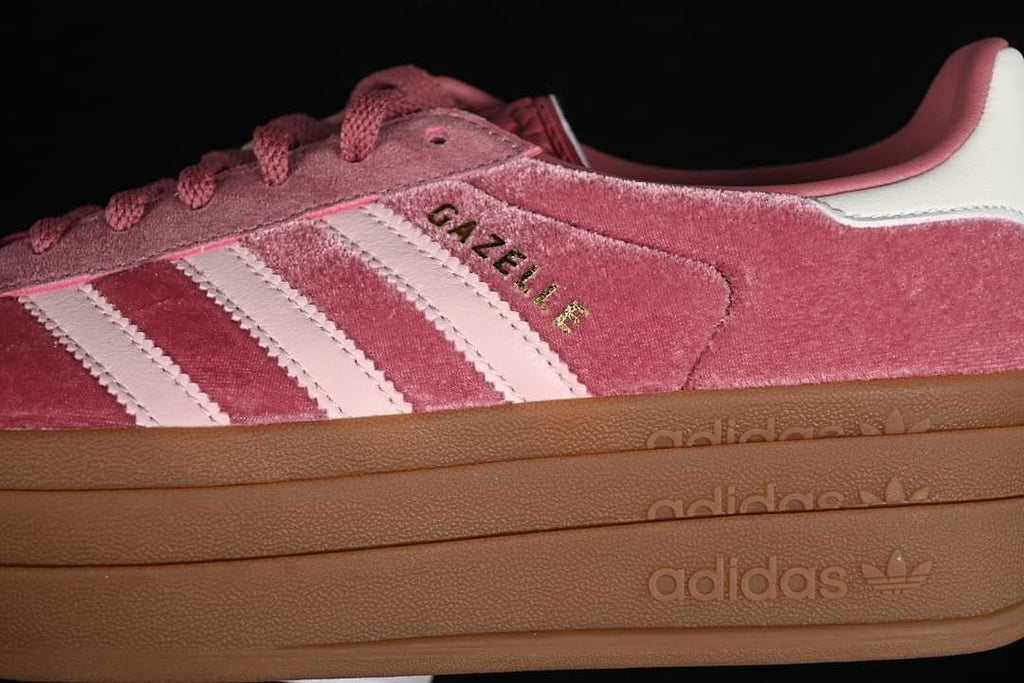 Close-up of the pink upper, pale stripes, Gazelle lettering, and platform sole