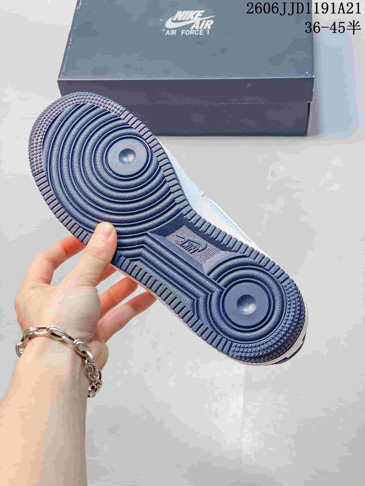 Close-up of the blue circular-patterned outsole on a Nike Air Force 1 Low sneaker.