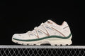 Side view of Salomon XT-Quest ADV sneakers in a light vanilla colorway with almond and dark green accents.