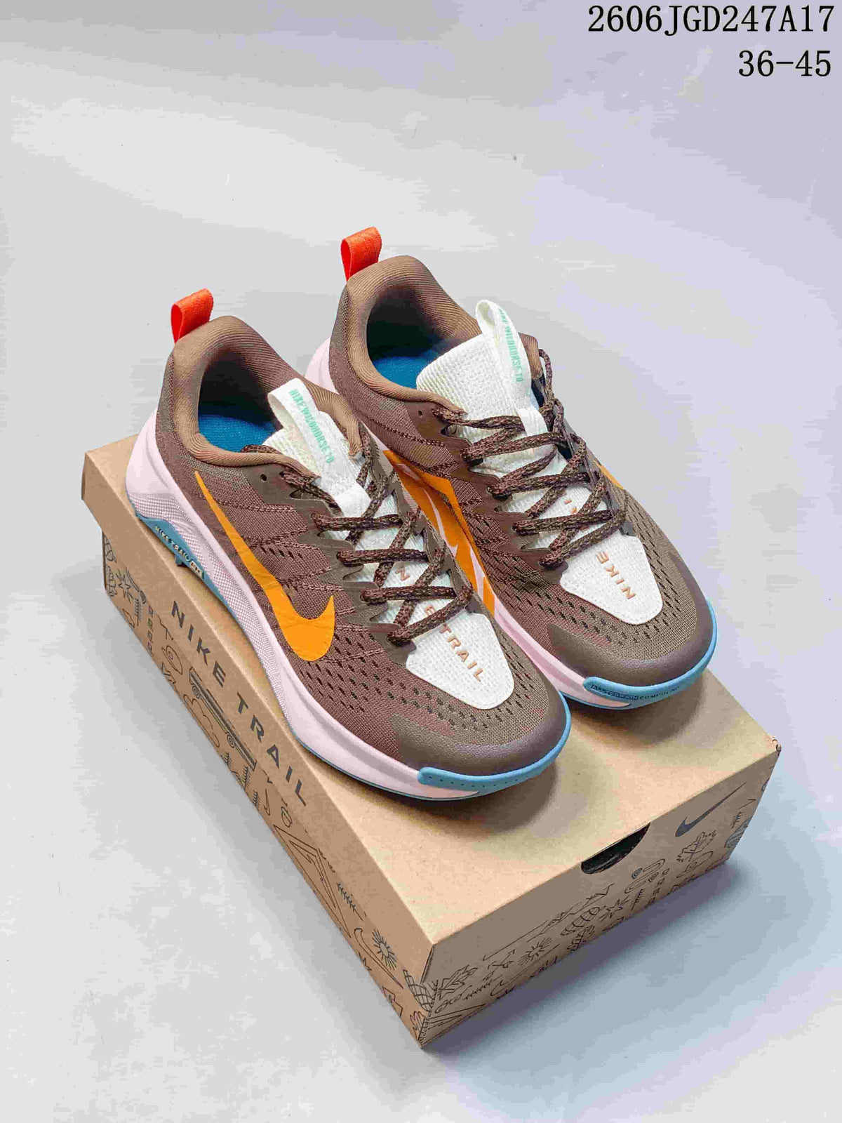 Brown and orange Nike Wildhorse 10 trail shoes on a Nike Trail box