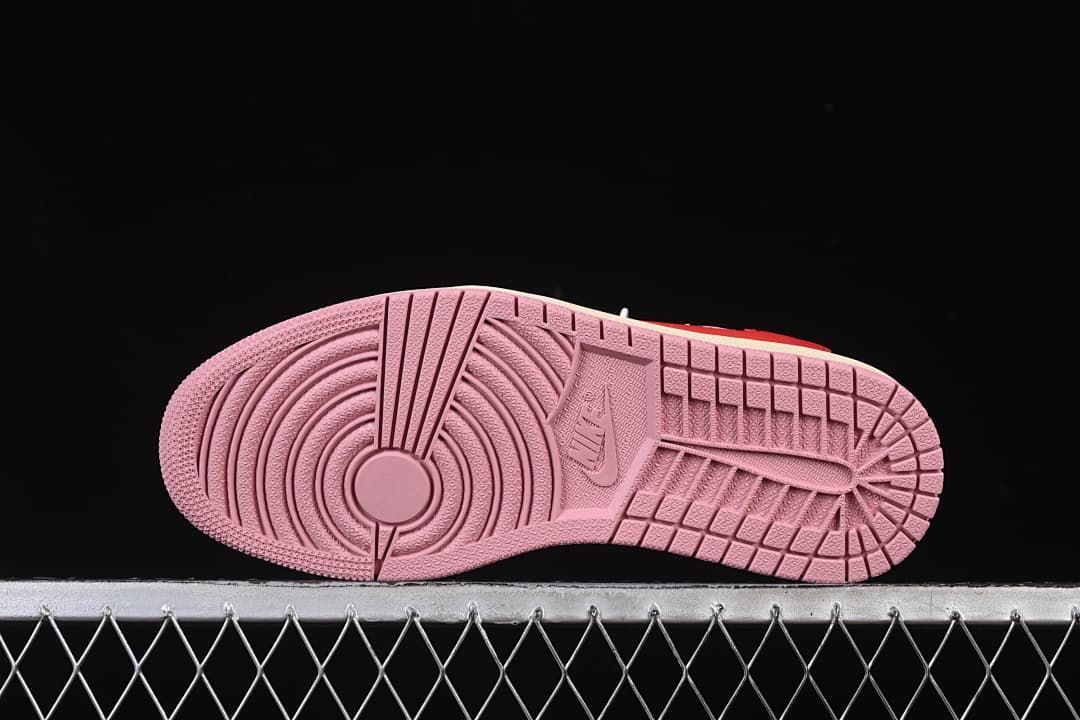Pink rubber outsole with circular tread pattern