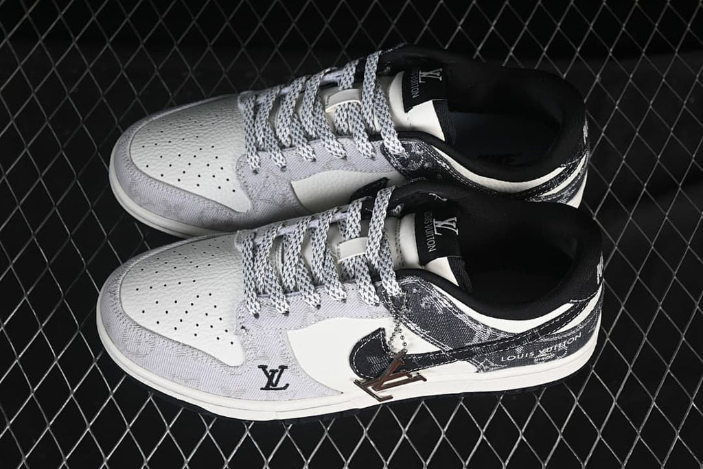 Pair of white and gray low-top sneakers shown from above, with patterned laces and dark overlays
