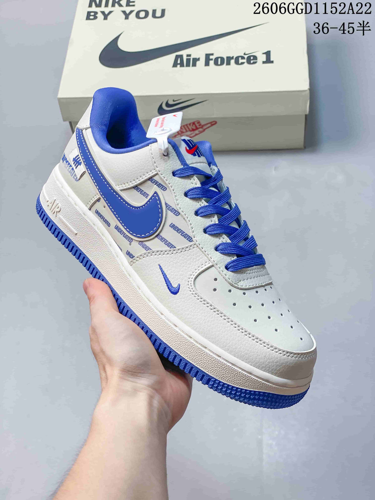 Angled side view of a white and blue Air Force 1 sneaker