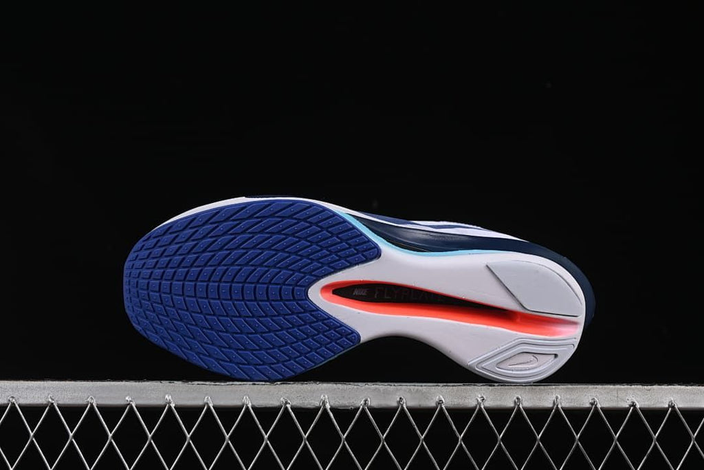 Underside view showing the outsole tread and central cutout.