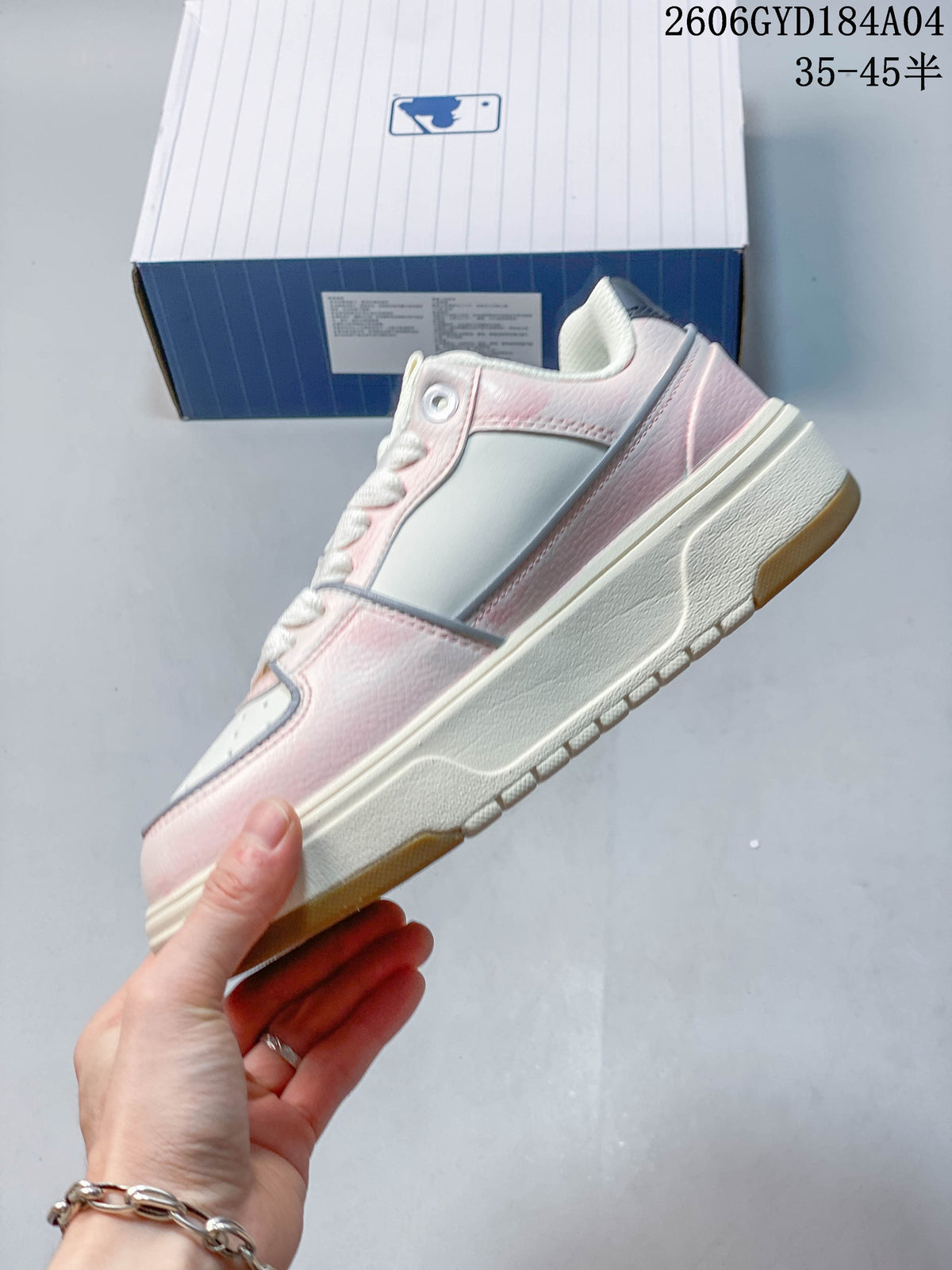 Side profile of the pink and white low-top sneaker