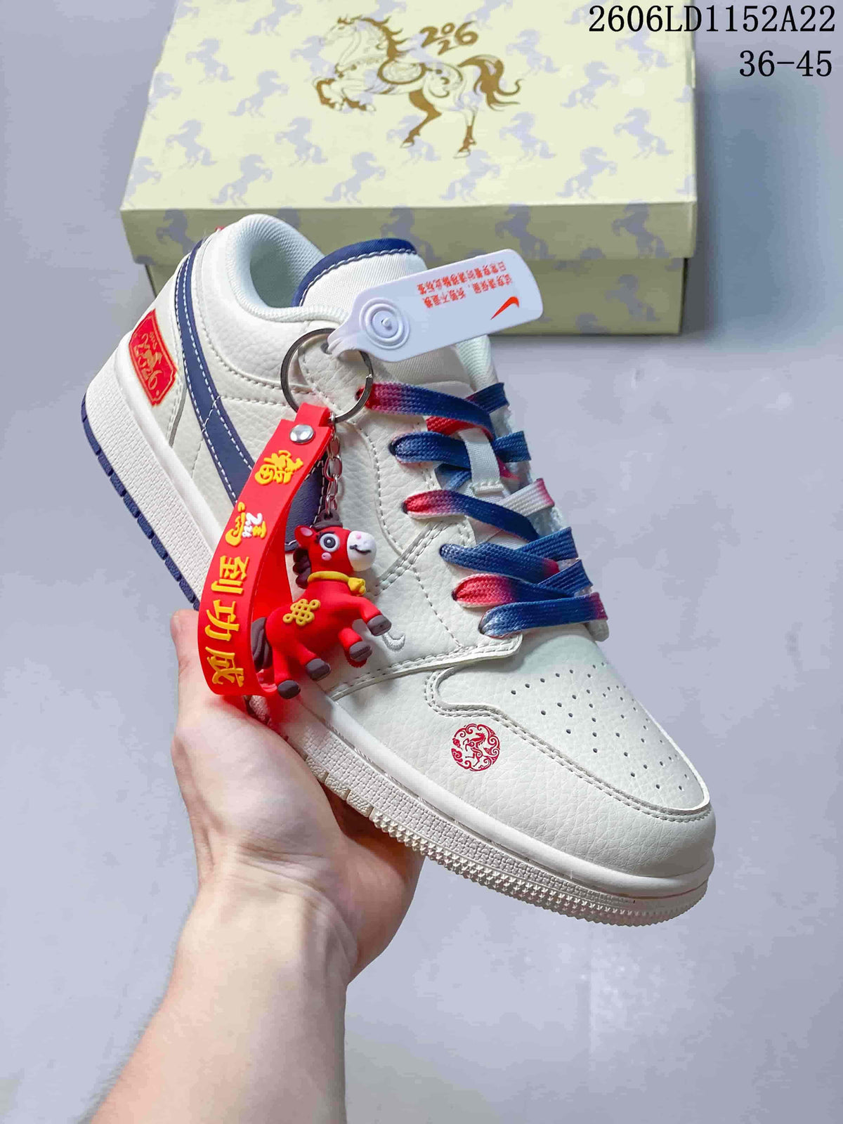 Angled view of the sneaker with red and blue accents and a small character charm