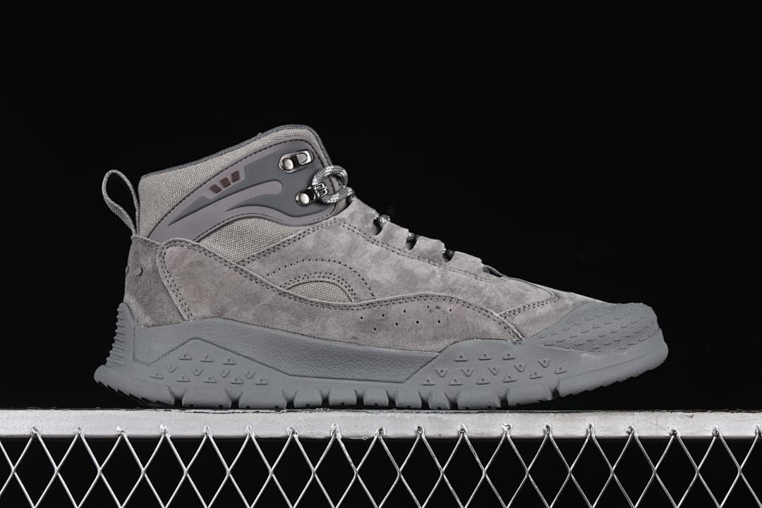 Side profile of the gray mid-top shoe