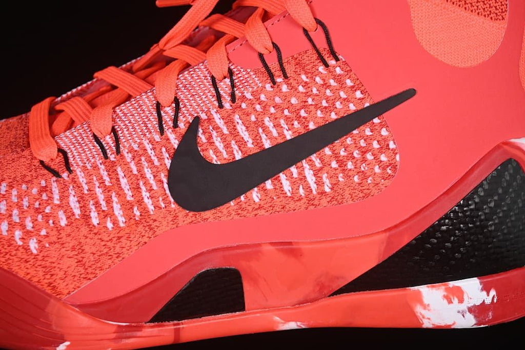 Close-up of the patterned upper, black swoosh, and side construction