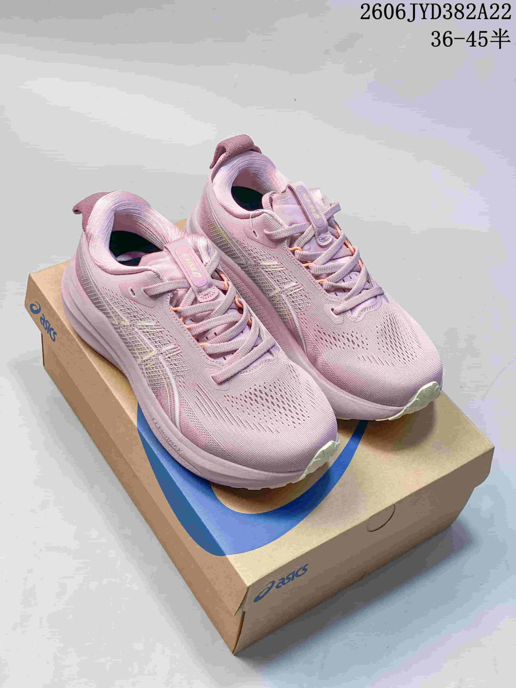 Pink ASICS Gel-Kayano 33 shoes shown from above on a shoe box