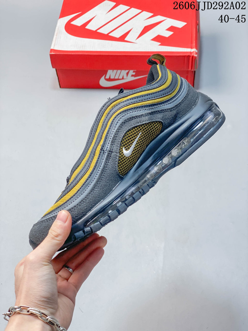 Side profile of the Nike Air Max 97 with layered overlays and visible Air unit
