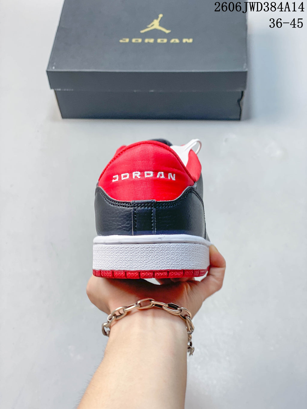 Rear view of a Jordan Court Connect sneaker with red heel lining