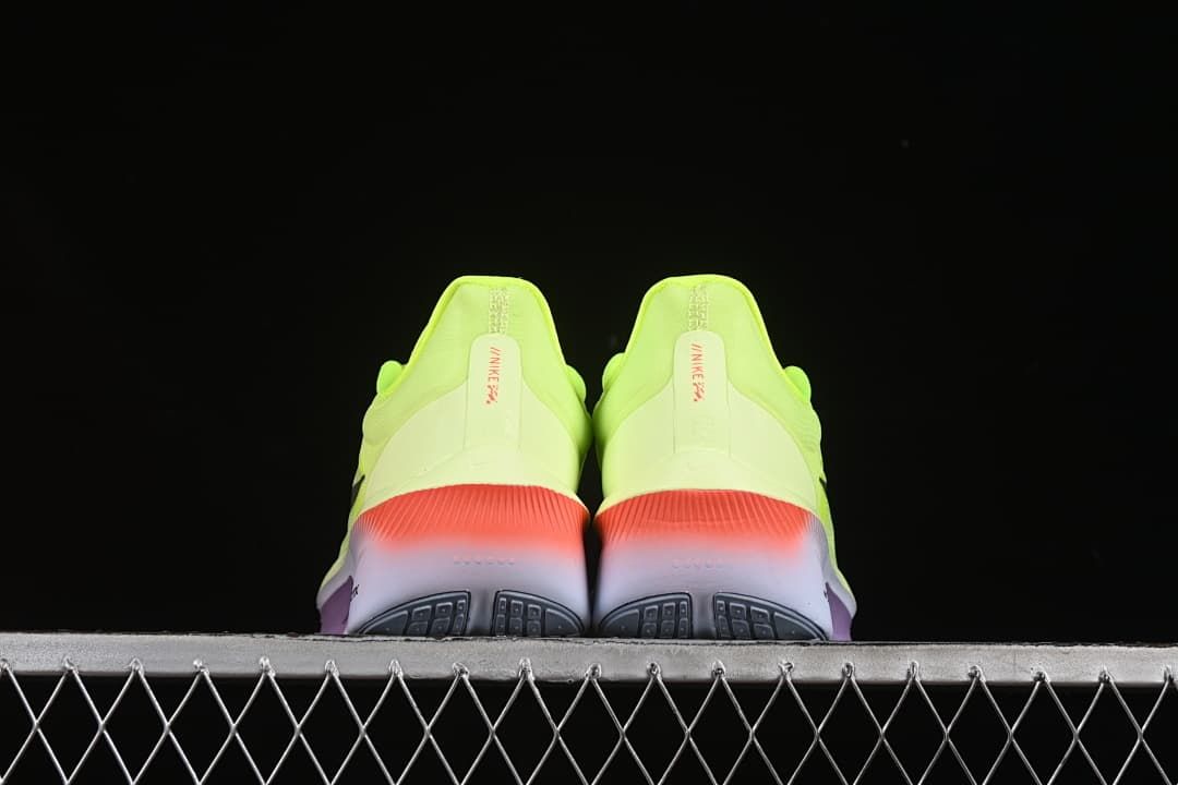 Rear view of the pair showing coral heel accents and the outsole.