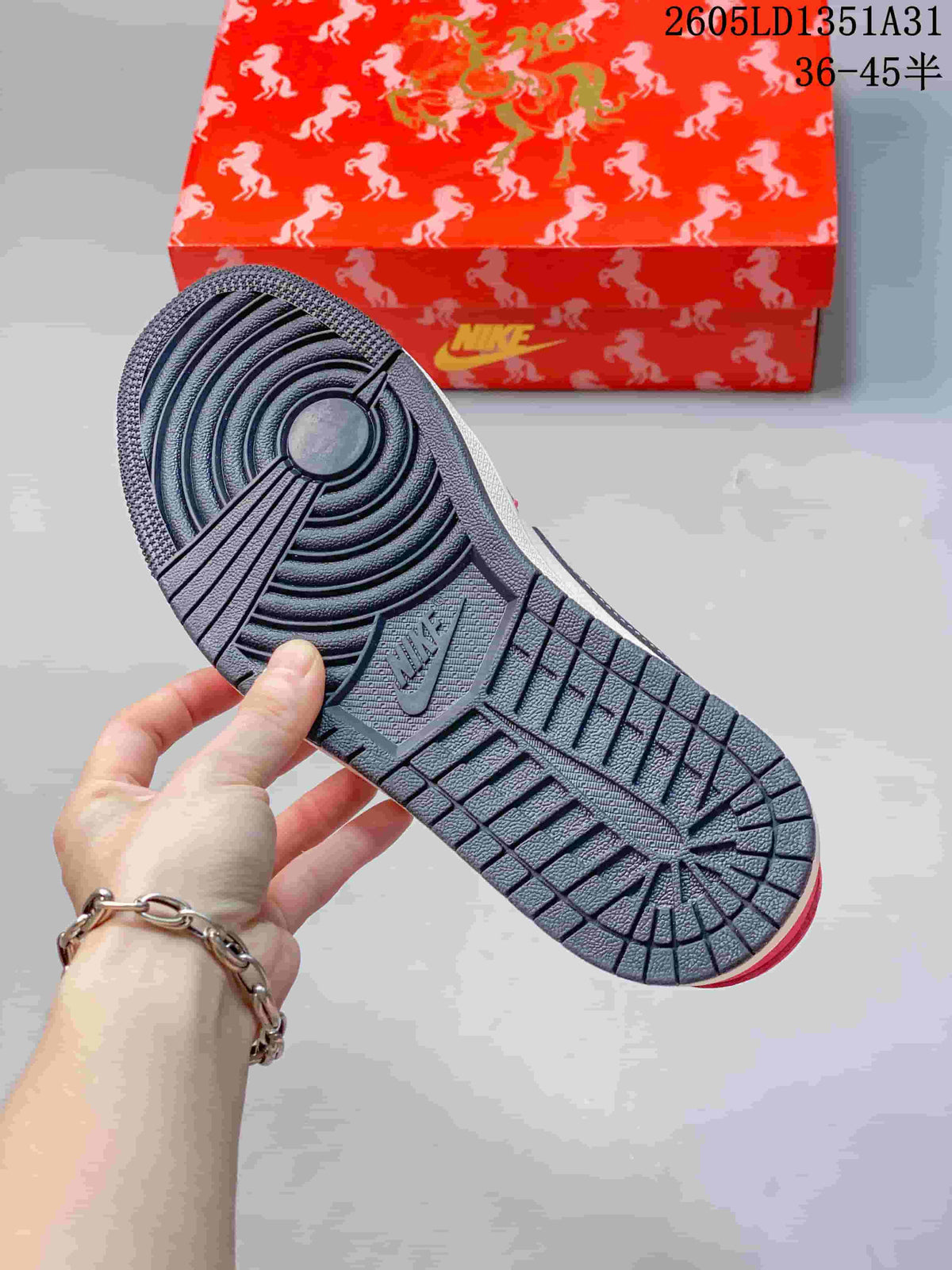 Close-up of the dark outsole and red horse-patterned shoebox