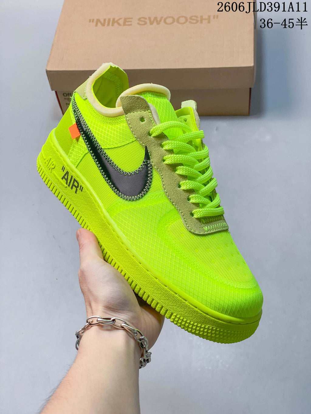 Angled side view of a volt-green low-top sneaker with dark Swoosh detailing
