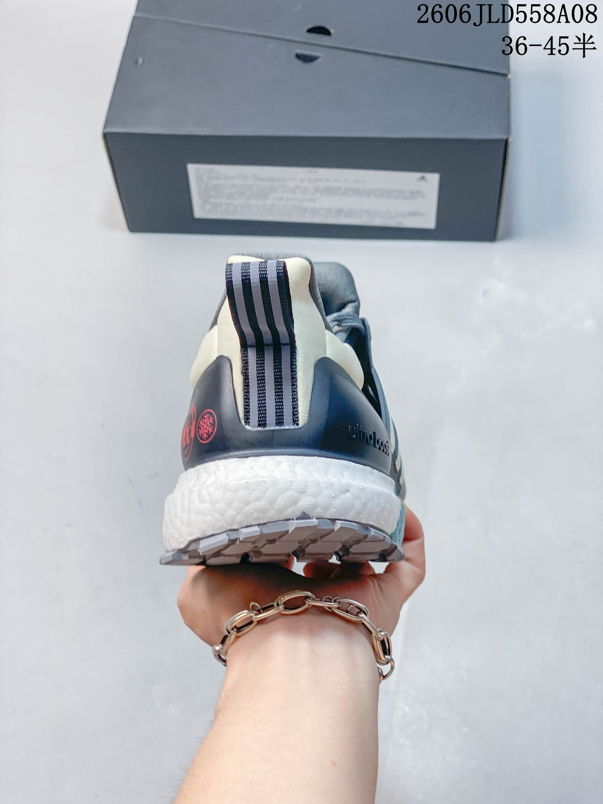 Rear view of a grey Adidas shoe showing the heel counter, pull tab, and white midsole.