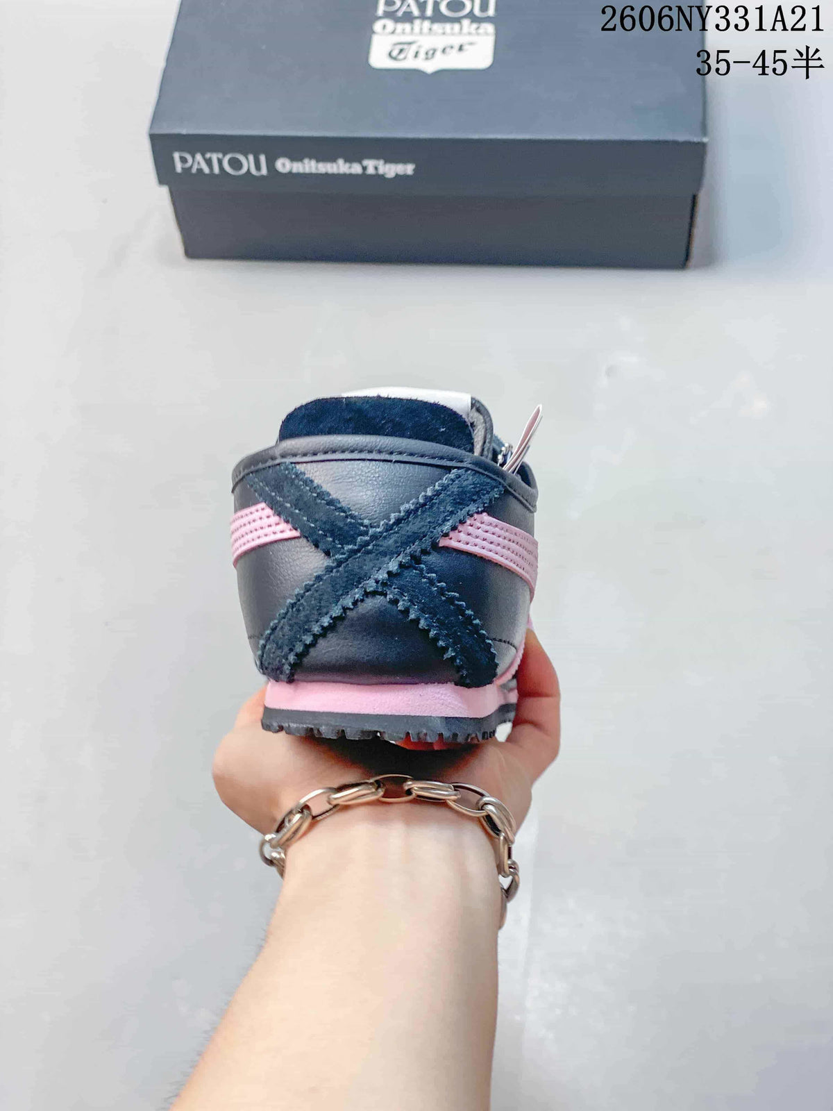Rear view of the sneaker showing crossed heel stripes and pink sole accents