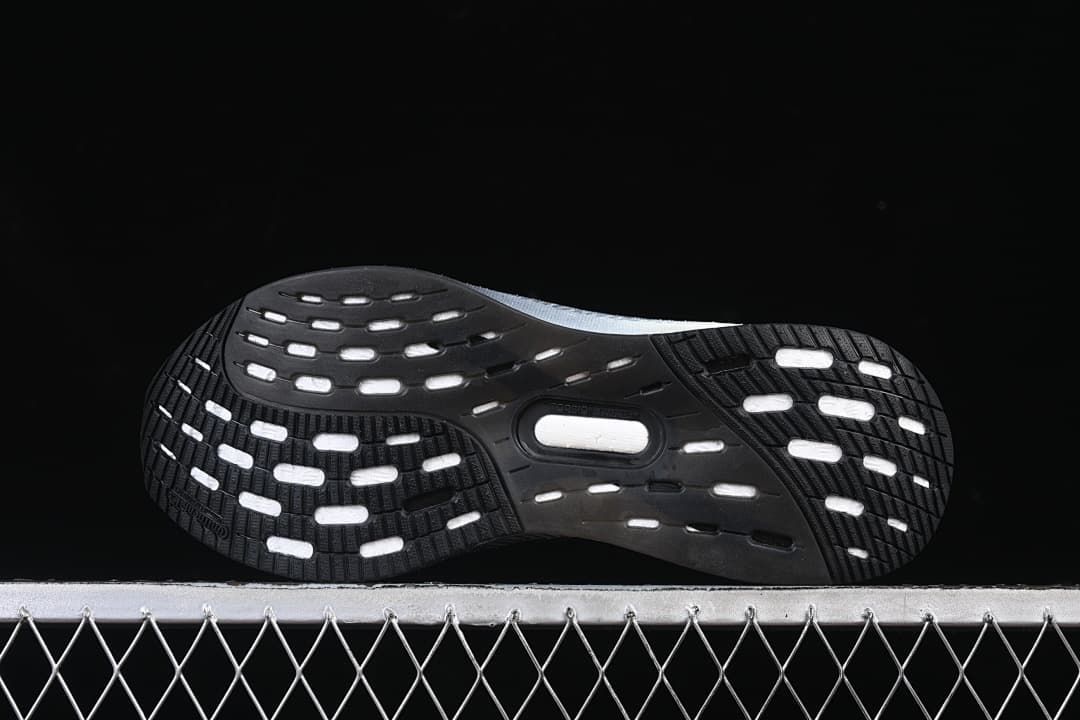 Bottom view showing the patterned black outsole