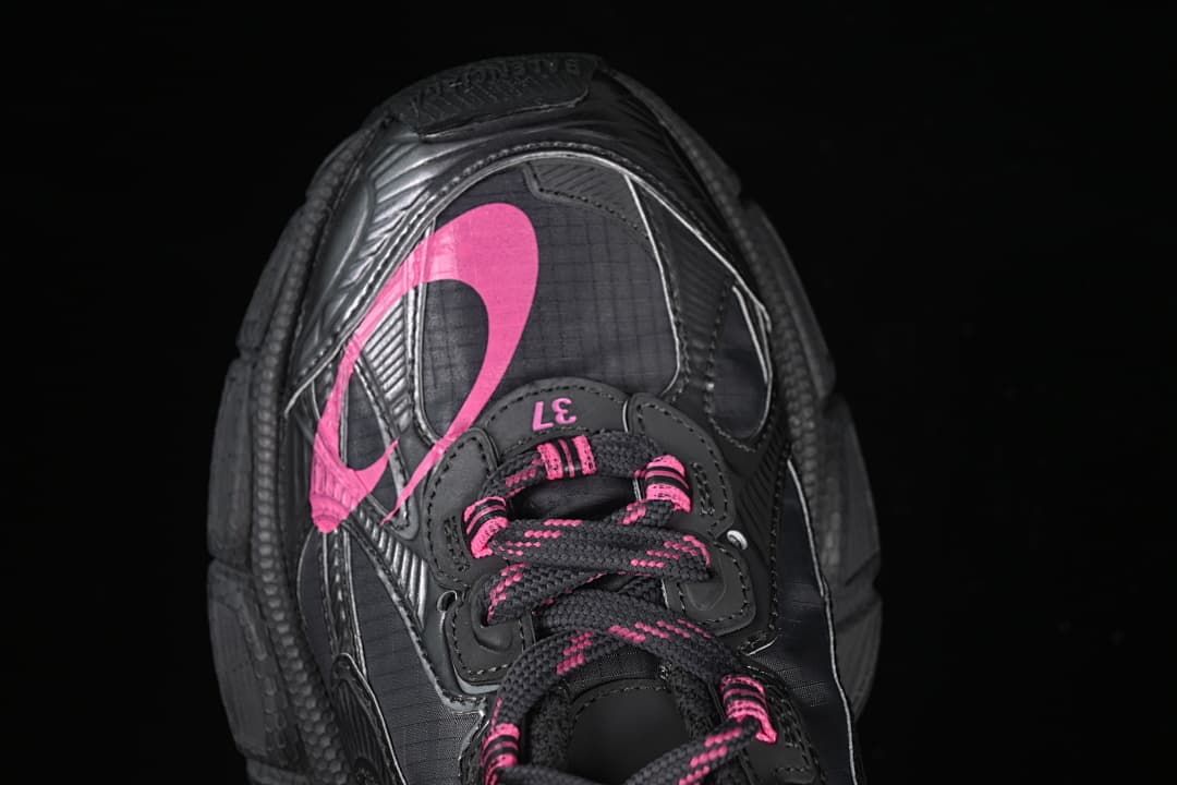 Top view of the sneaker showing its pink upper graphic and lacing.