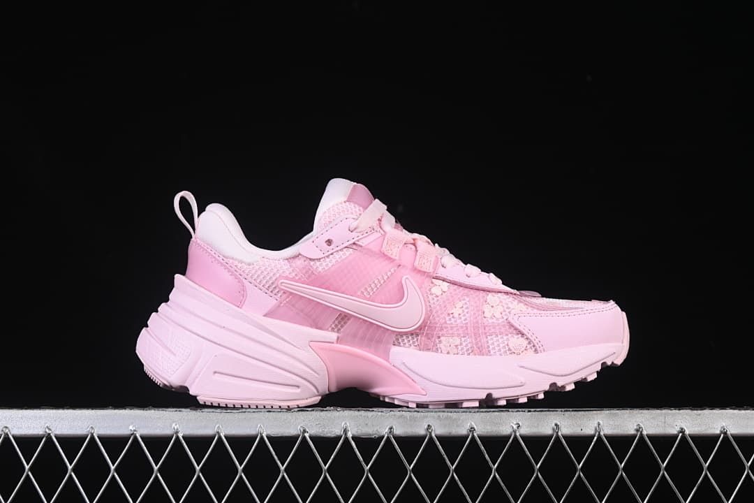 Side profile of a pink Nike V2K Run sneaker
