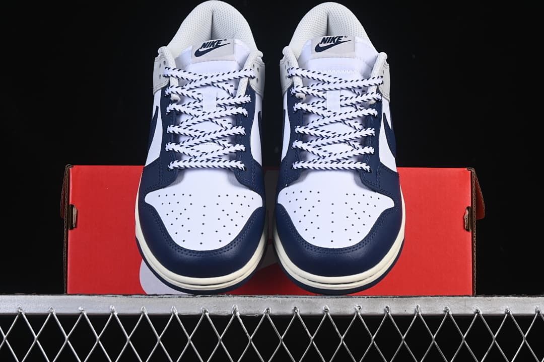 Front view of both sneakers showing perforated toes and contrast laces