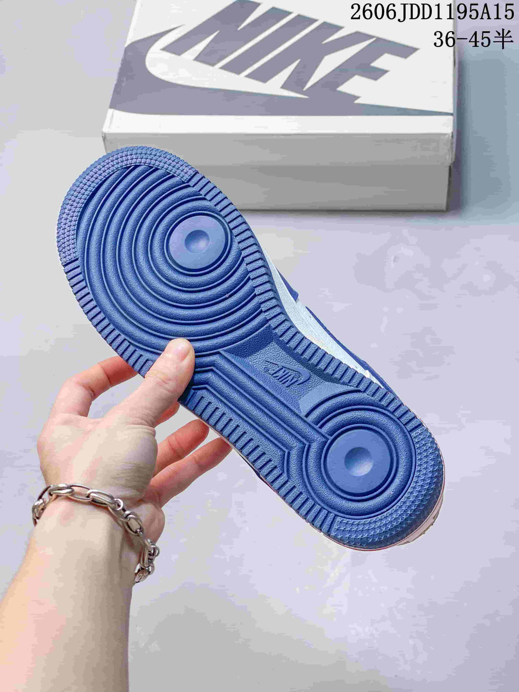 Blue outsole of a Nike Air Force 1 Low sneaker