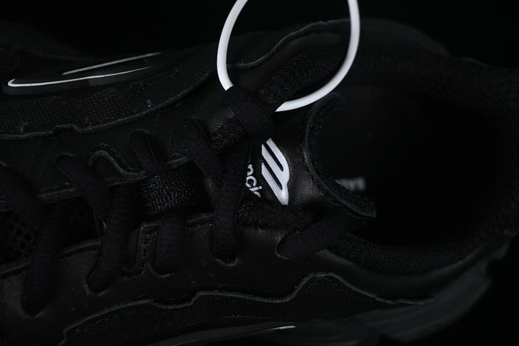 Close-up of the black laces and upper panels
