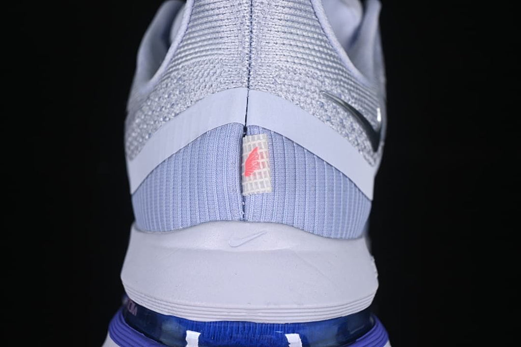 Rear view showing the heel and blue-toned midsole unit