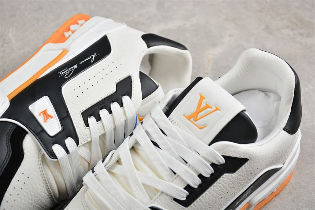 Close-up of the LV Trainer sneakers showing laces, tongue, and side branding