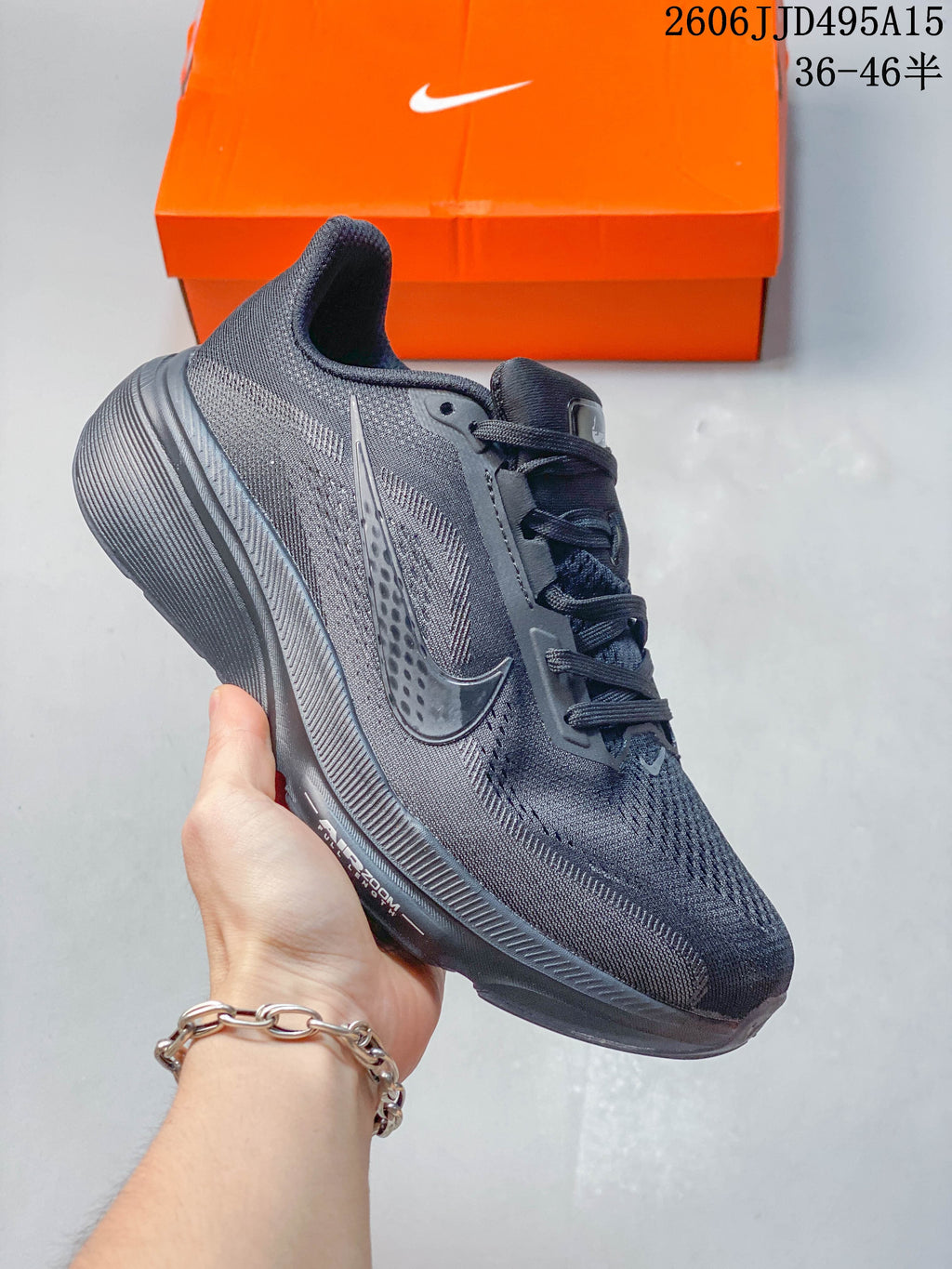Dark gray Nike Air Zoom Pegasus 42 shoe with matching laces and sole