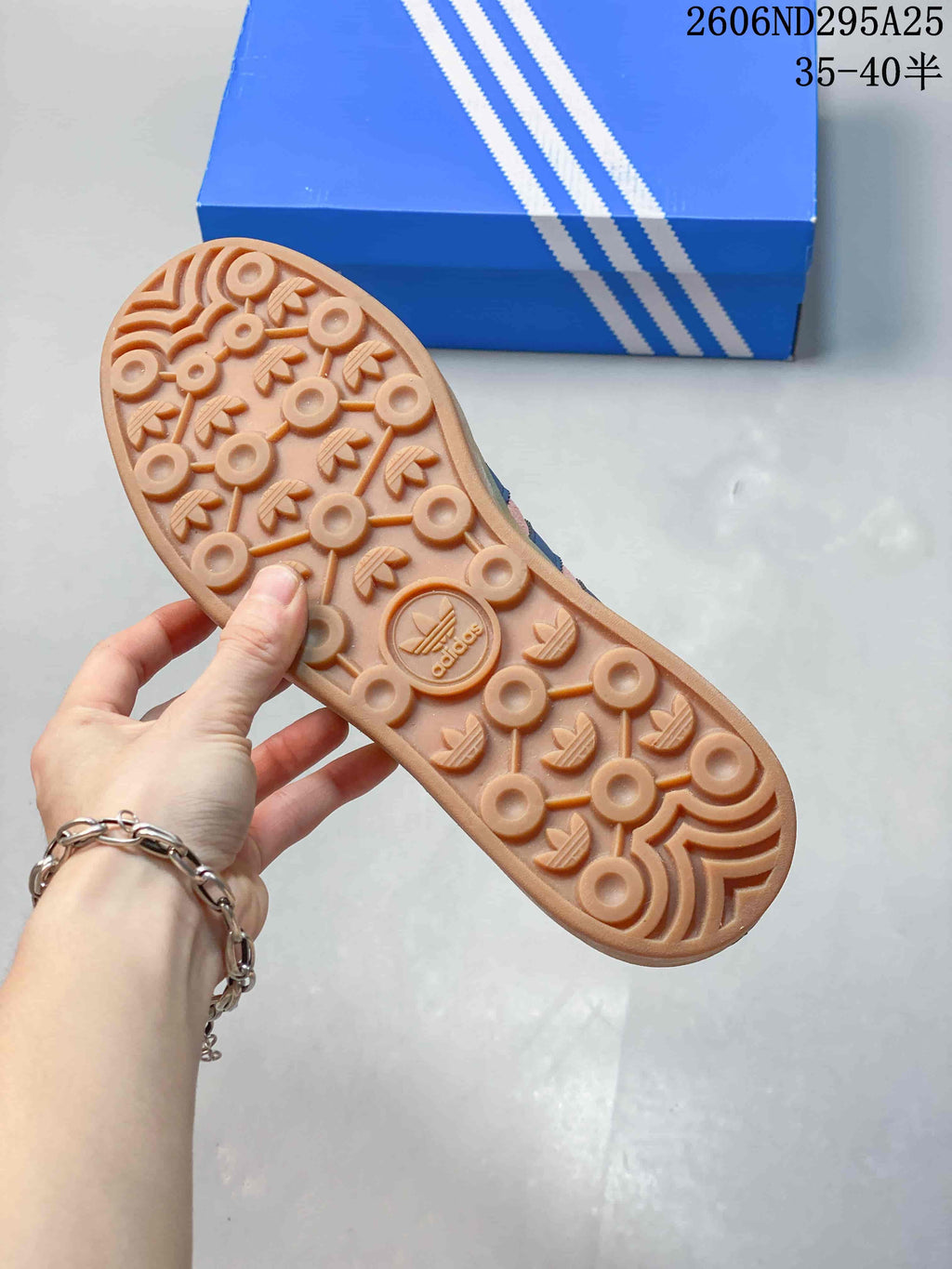 Underside of a sneaker showing a patterned gum-look outsole