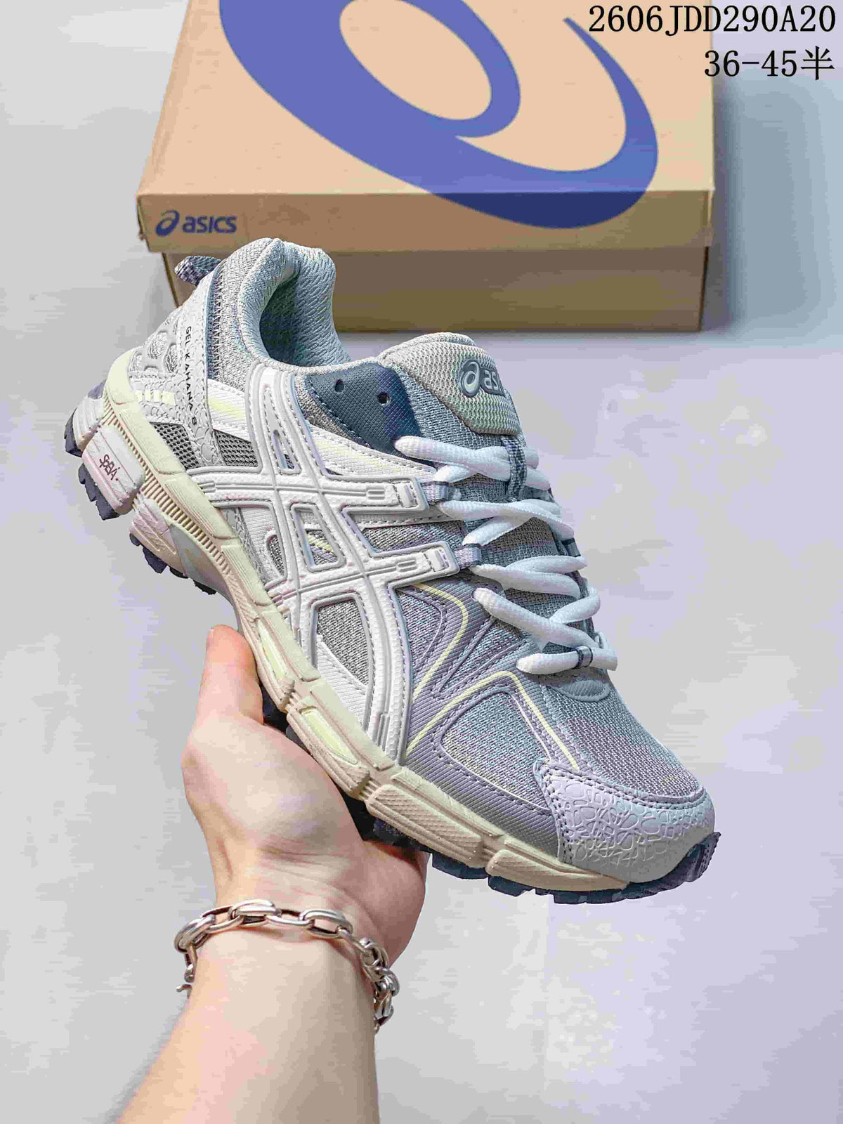 ASICS Gel-Kahana 8 sneaker in grey and lavender tones with white overlays.